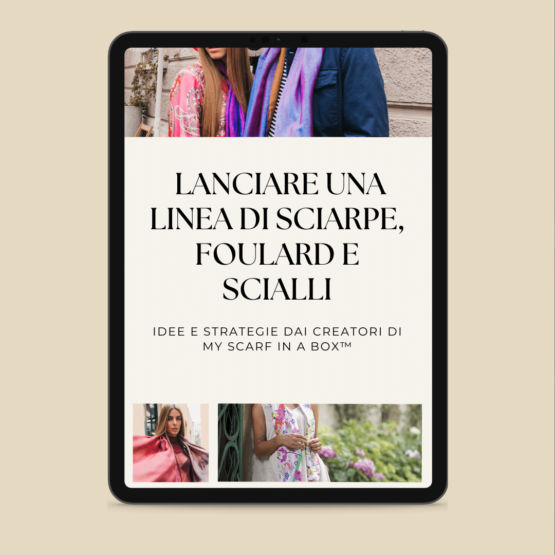 Un tablet che mostra una pagina del sito web in italiano sul lancio di una linea di sciarpe, con immagini di donne che indossano diverse sciarpe.