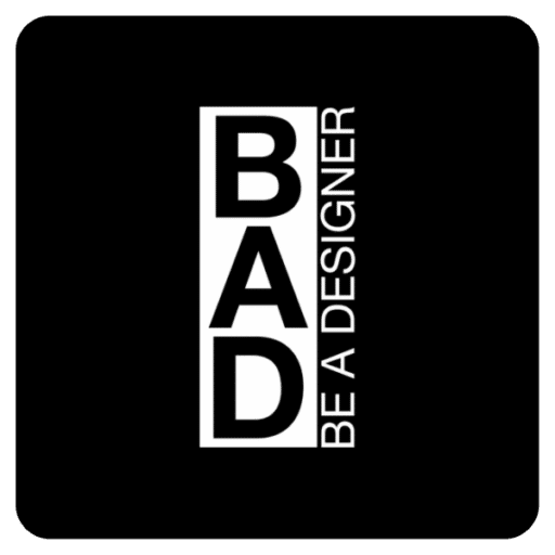 Quadrato nero con l'acronimo "BAD" a grandi lettere, con la scritta "BE A DESIGNER" verticalmente a destra dell'acronimo. Sfondo nero con un rettangolo bianco che evidenzia le lettere.
